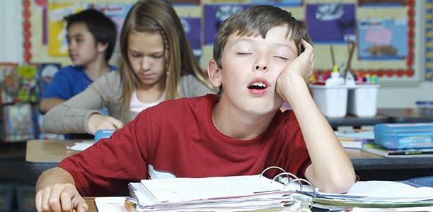child_boy_sleeping_school_classroom-612x300
